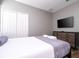 Comfortable bedroom with a large bed, dresser, and TV at 5300 Oakbourne Ave, Davenport, FL 33837