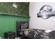 Twin beds in Jurassic Park themed bedroom with camo decor at 5300 Oakbourne Ave, Davenport, FL 33837