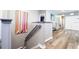 Upstairs hall with gray walls and wood-look floors at 5300 Oakbourne Ave, Davenport, FL 33837