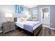 Bright bedroom with a queen-size bed and en-suite bathroom at 5300 Oakbourne Ave, Davenport, FL 33837