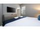 Main bedroom with large bed, dresser and plenty of natural light at 5300 Oakbourne Ave, Davenport, FL 33837