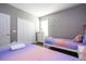 Two twin beds in a whimsical bedroom with star and moon bedding at 5300 Oakbourne Ave, Davenport, FL 33837