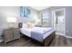 Bedroom with a double bed, nightstands, and en-suite bathroom access at 5300 Oakbourne Ave, Davenport, FL 33837