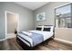 Cozy bedroom with a full-size bed and adjacent bathroom at 5300 Oakbourne Ave, Davenport, FL 33837