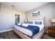King-size bed with headboard in a stylish bedroom, en-suite bathroom at 5300 Oakbourne Ave, Davenport, FL 33837