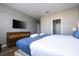 Main bedroom with king-size bed, dresser and ensuite bathroom at 5300 Oakbourne Ave, Davenport, FL 33837