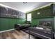 ' bedroom with twin beds, dinosaur mural, and camouflage decor at 5300 Oakbourne Ave, Davenport, FL 33837