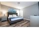 Spacious main bedroom with king-size bed and wood-look floors at 5300 Oakbourne Ave, Davenport, FL 33837