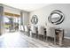 Elegant dining room with a large table and access to the patio at 5300 Oakbourne Ave, Davenport, FL 33837