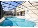 Inviting pool area with covered lanai, spa, and plenty of seating at 5300 Oakbourne Ave, Davenport, FL 33837