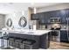 Modern kitchen with stainless steel appliances and an island with seating at 5300 Oakbourne Ave, Davenport, FL 33837