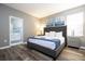 Main bedroom with king-size bed and en-suite bathroom at 5300 Oakbourne Ave, Davenport, FL 33837