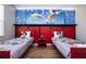 Mickey Mouse themed bedroom with twin beds and a fun wall mural at 5300 Oakbourne Ave, Davenport, FL 33837