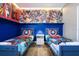 ' bedroom with twin beds and Marvel-themed decor at 5300 Oakbourne Ave, Davenport, FL 33837