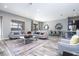 Open living space with ample seating and large windows at 5300 Oakbourne Ave, Davenport, FL 33837