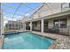 Private screened pool and spa with a large patio area at 8834 Cabot Cliffs Dr, Davenport, FL 33896
