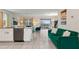 Modern kitchen with white cabinets, stainless steel appliances and open to Gathering room at 8834 Cabot Cliffs Dr, Davenport, FL 33896