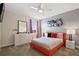 Bedroom with Queen bed, gray walls, and modern decor at 8834 Cabot Cliffs Dr, Davenport, FL 33896