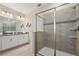 Main bathroom with double vanity and walk-in shower at 8834 Cabot Cliffs Dr, Davenport, FL 33896
