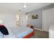 Bedroom with Queen bed, adjacent bathroom access, and TV at 8834 Cabot Cliffs Dr, Davenport, FL 33896