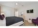 Spacious bedroom with a king-size bed, TV, and ample closet space at 8834 Cabot Cliffs Dr, Davenport, FL 33896