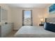 Bedroom with a queen bed, dresser, and a window with blinds at 8834 Cabot Cliffs Dr, Davenport, FL 33896