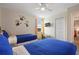 ' bedroom with twin beds, TV, and Minion wall decals at 8834 Cabot Cliffs Dr, Davenport, FL 33896