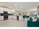 Modern kitchen with white cabinets, stainless steel appliances, and an island at 8834 Cabot Cliffs Dr, Davenport, FL 33896