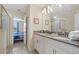 Bathroom with double vanity, and a view into a bedroom at 8834 Cabot Cliffs Dr, Davenport, FL 33896