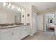 Bathroom with double vanity and linen closet at 8834 Cabot Cliffs Dr, Davenport, FL 33896