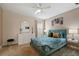 Bedroom with a queen bed and stylish decor at 8834 Cabot Cliffs Dr, Davenport, FL 33896