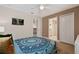 Bedroom with a queen bed, and access to bathroom at 8834 Cabot Cliffs Dr, Davenport, FL 33896