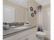 Bathroom with vanity, toilet, shower, and decorative mirrors at 8834 Cabot Cliffs Dr, Davenport, FL 33896