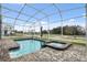 Relaxing screened pool and spa with spacious patio at 8834 Cabot Cliffs Dr, Davenport, FL 33896