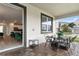 Inviting patio with seating for four, ideal for outdoor dining at 8834 Cabot Cliffs Dr, Davenport, FL 33896