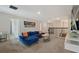 Spacious game room with sectional sofa and access to upper hallway at 8834 Cabot Cliffs Dr, Davenport, FL 33896