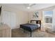 Cozy bedroom with a queen-size bed and built-in wardrobe at 8834 Cabot Cliffs Dr, Davenport, FL 33896