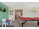 Game room with pool table and access to upper level at 8834 Cabot Cliffs Dr, Davenport, FL 33896
