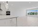 Open concept kitchen and living area with large windows at 9832 Bucklow Hill Dr, Orlando, FL 32832