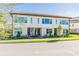 Three-story townhouses with landscaped yards and attractive facades at 9832 Bucklow Hill Dr, Orlando, FL 32832