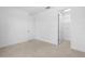 Simple bedroom with carpet, closet, and door to bathroom at 9832 Bucklow Hill Dr, Orlando, FL 32832