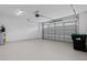 Spacious garage with open door, ample space for parking and storage at 9832 Bucklow Hill Dr, Orlando, FL 32832