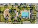 An overhead view of a community pool, playground, and recreational areas at 9832 Bucklow Hill Dr, Orlando, FL 32832