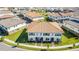 Aerial view of townhouses with tile roofs, landscaping, and a community at 9832 Bucklow Hill Dr, Orlando, FL 32832