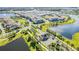 Aerial view showing community entrance and lake at 9832 Bucklow Hill Dr, Orlando, FL 32832