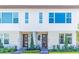 Modern townhouses with stylish stone accents and landscaping at 9832 Bucklow Hill Dr, Orlando, FL 32832