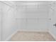 Large walk-in closet with wire shelving and hanging rods at 9832 Bucklow Hill Dr, Orlando, FL 32832