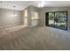 Spacious living room with a neutral color palette and carpeted floor at 196 Riverbend Dr # 204, Altamonte Springs, FL 32714