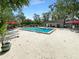 Community pool with lounge chairs and surrounding greenery at 196 Riverbend Dr # 204, Altamonte Springs, FL 32714