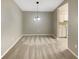 Dining area with carpeted floors and light fixtures at 196 Riverbend Dr # 204, Altamonte Springs, FL 32714